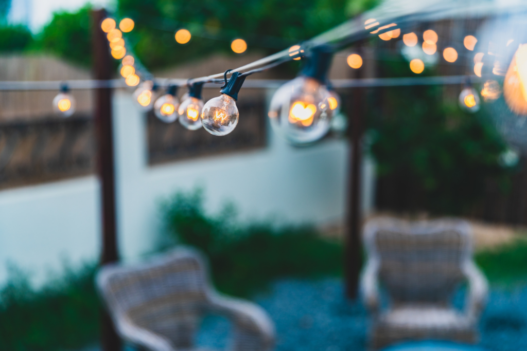 outdoor string light over patio chairs