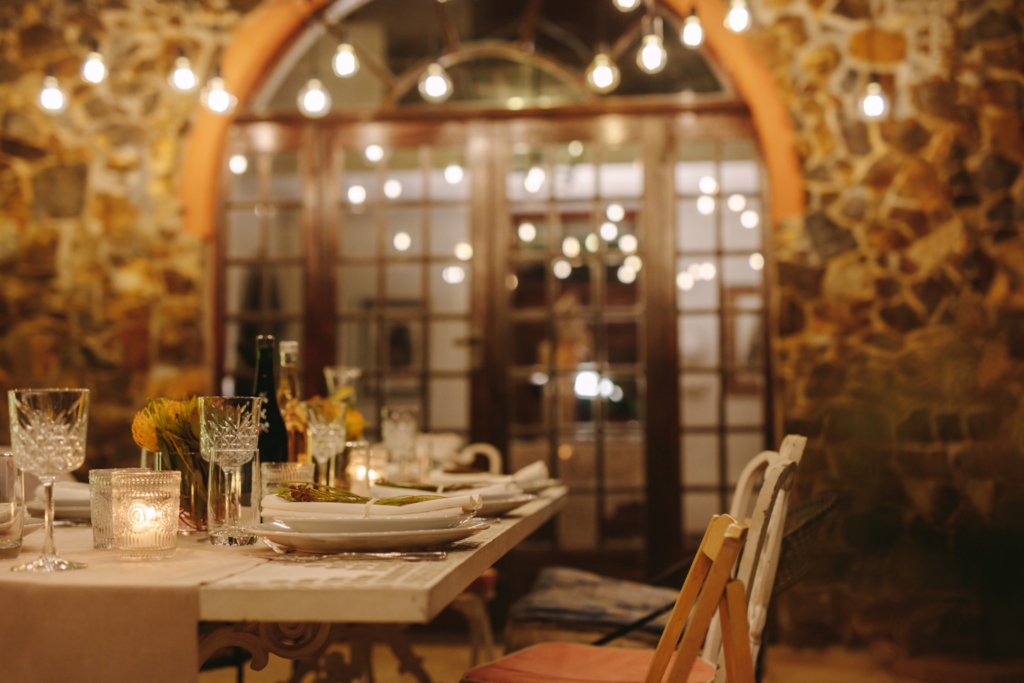 an elegant set dining table with hanging lighting