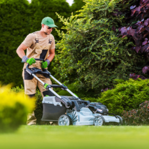 man pushing a cordless mower