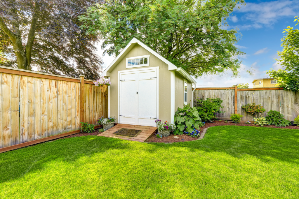 shed in a fenced backyard