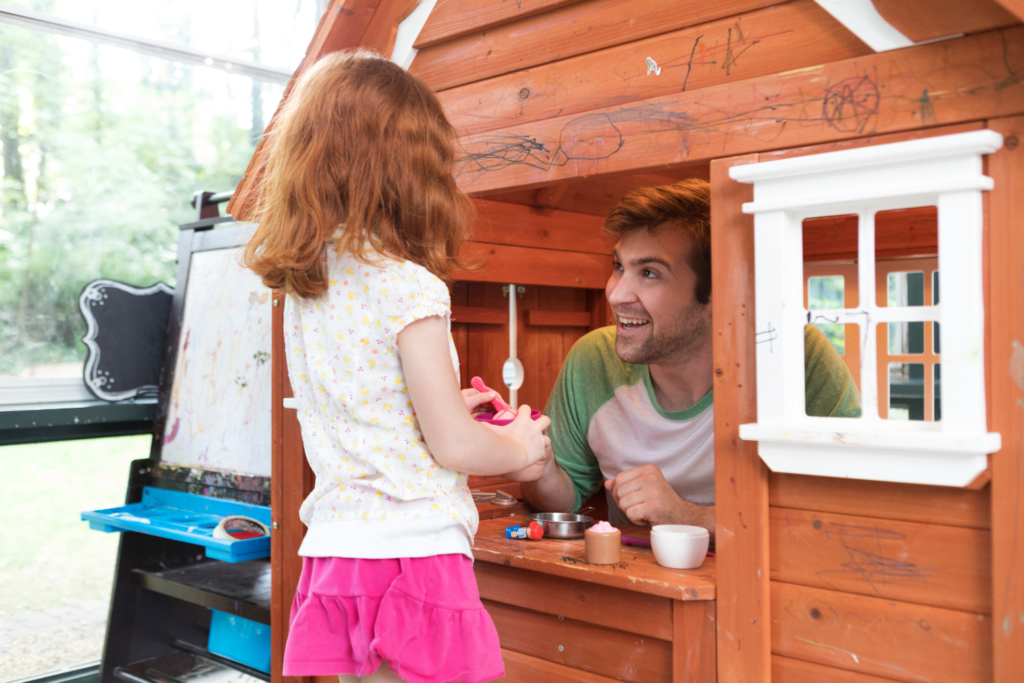 Dad and daughter in a playhouse