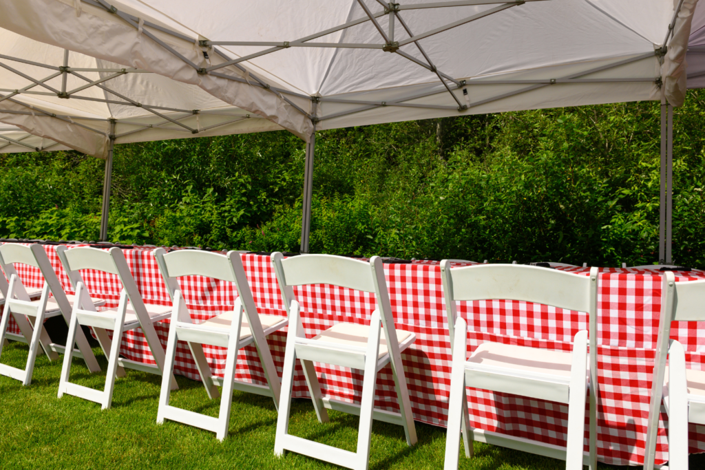 Canopy party tent with chairs and tables