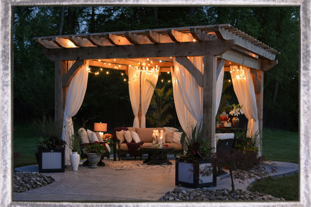 Lighted pergola with white curtains and lighting